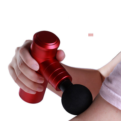 Red handheld massage device being used on a person's arm against a white background