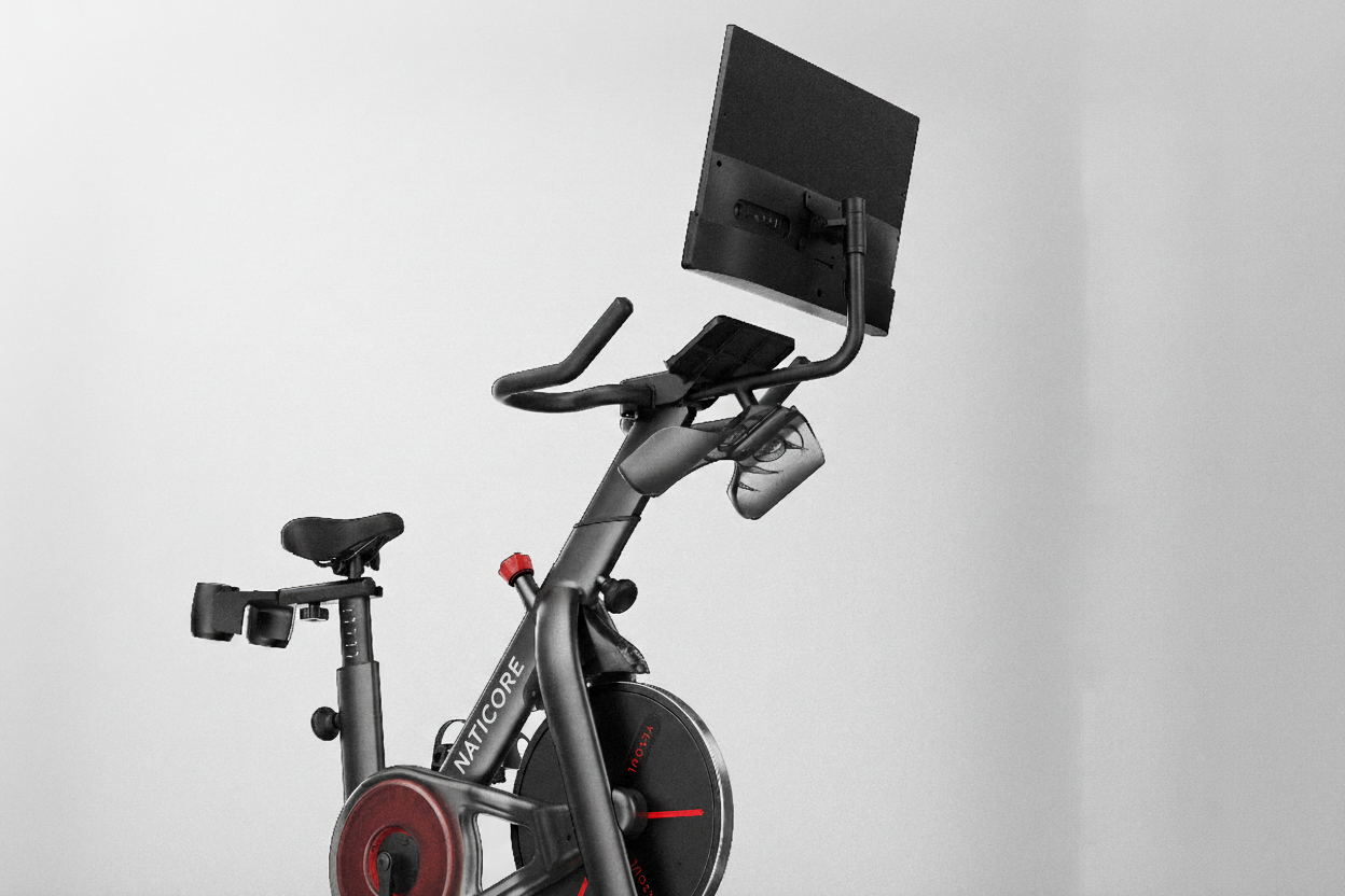 Exercise bike with a screen on a gray background