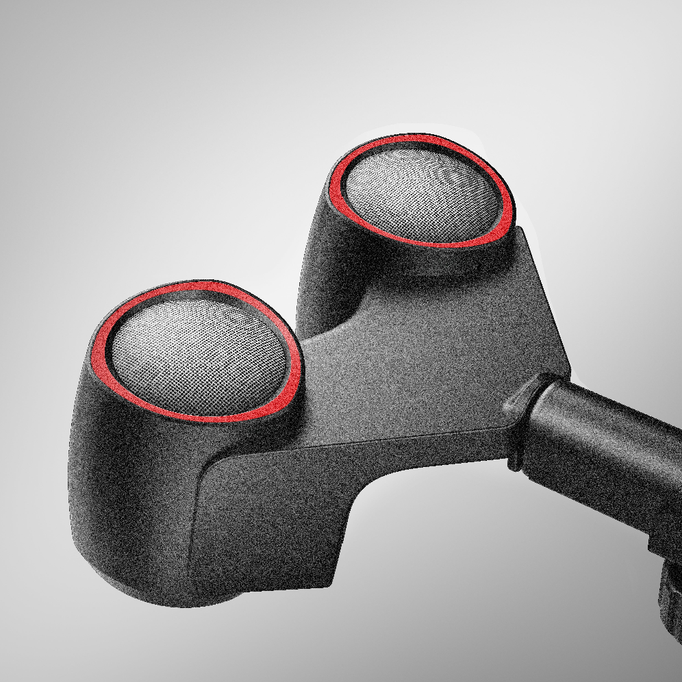 Close-up of a black and red golf club head on a gray background