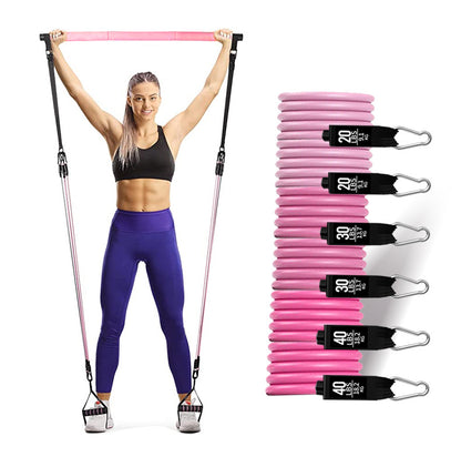 Woman exercising with resistance bands and a set of pink resistance bands on a white background