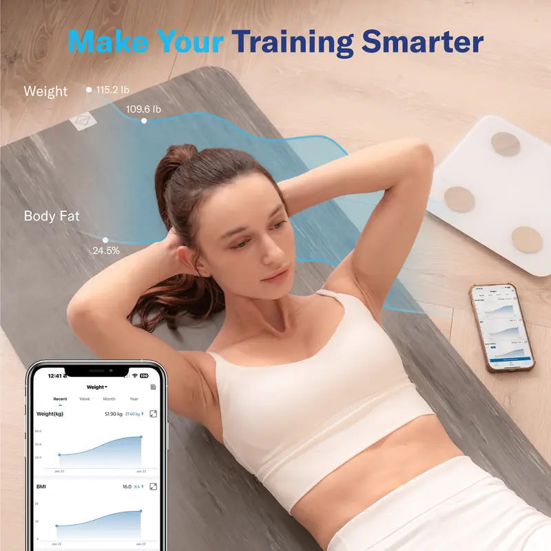 Woman lying on a fitness mat with a smartphone displaying health app, weight scale in the background.