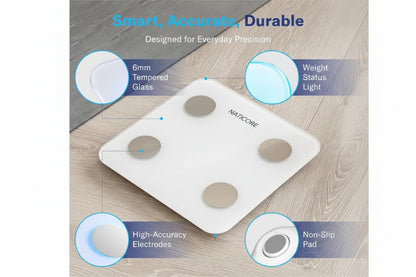 White digital scale with features highlighted on a wooden surface